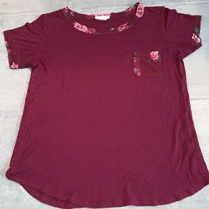 Tilly’s maroon shirt